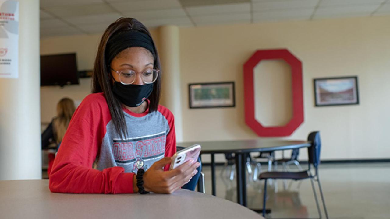 Student looking at phone