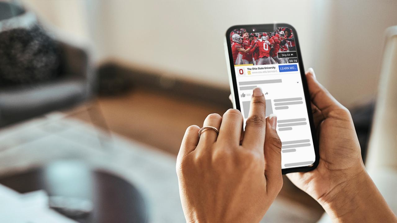 Woman watching youtube ad on phone